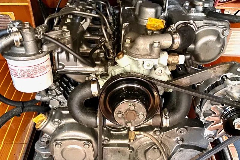 Aundrea Lynn Yacht Photos Pics Engine of a 1997 Beneteau Oceanis 461 sailboat, showcasing mechanical components and belts.