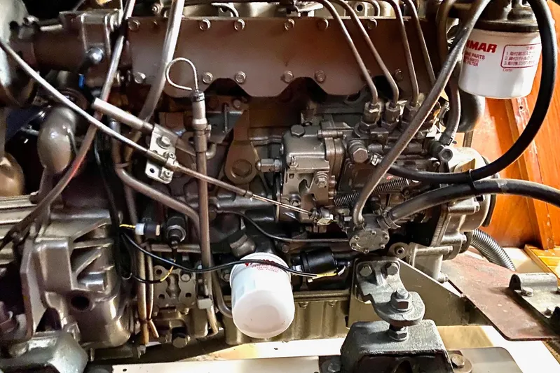 Aundrea Lynn Yacht Photos Pics Engine of a 1997 Beneteau Oceanis 461 sailboat, showcasing intricate mechanical components.