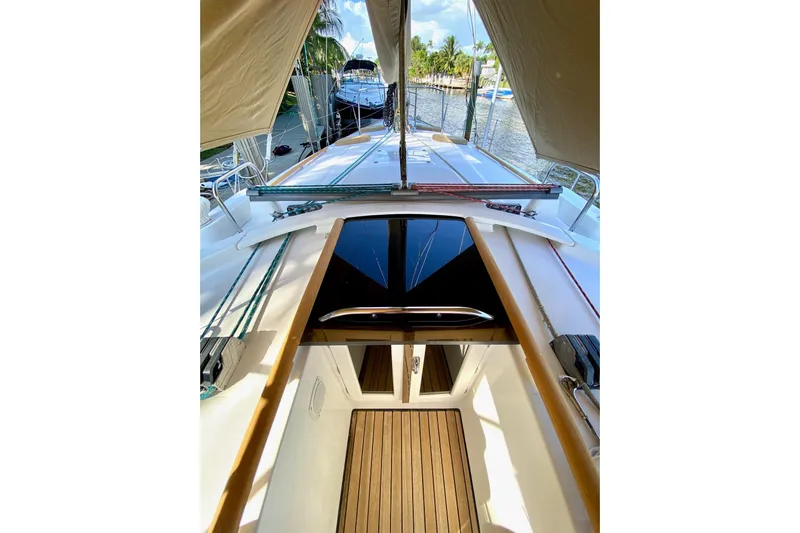 Aundrea Lynn Yacht Photos Pics 1997 Beneteau Oceanis 461 sailboat deck view with wooden flooring and canopy.