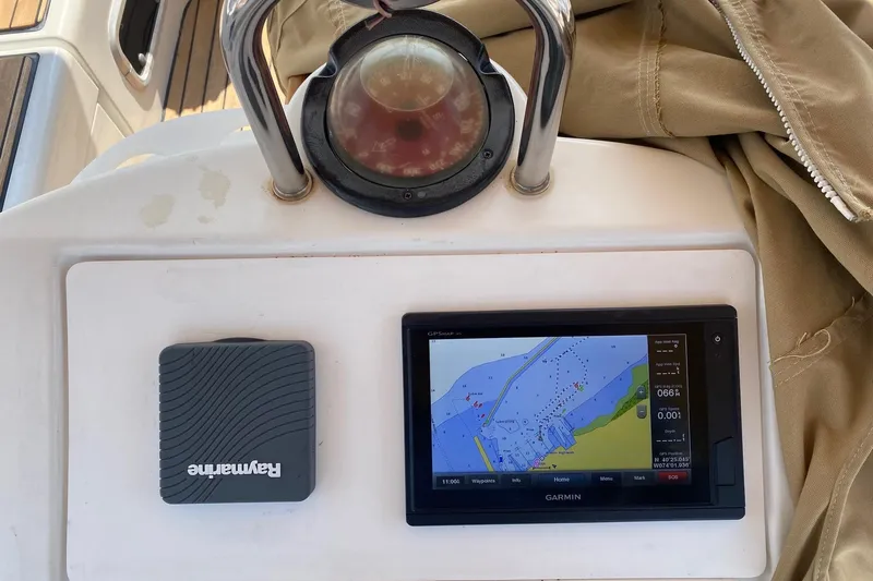 Aundrea Lynn Yacht Photos Pics Navigation equipment on 1997 Beneteau Oceanis 461 sailboat, featuring Garmin and Raymarine devices.
