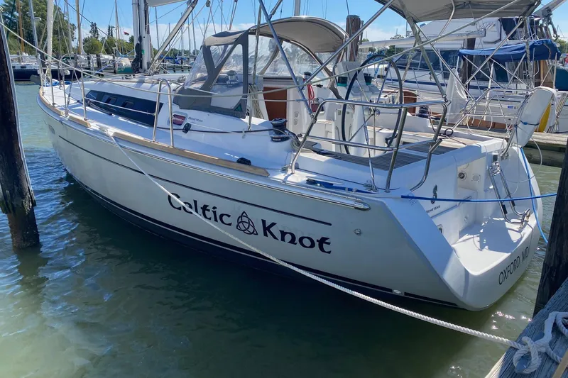 Celtic Knot Yacht Photos Pics 2014 Beneteau Oceanis 34 sailboat named "Celtic Knot" docked in a marina.