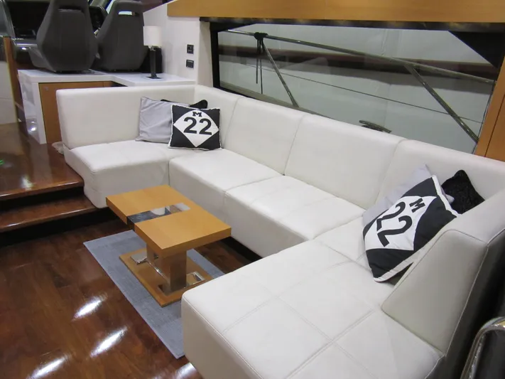 Skeis The Limit Yacht Photos Pics Luxurious interior of 2014 Sunseeker Manhattan 53 yacht with white seating and modern decor.