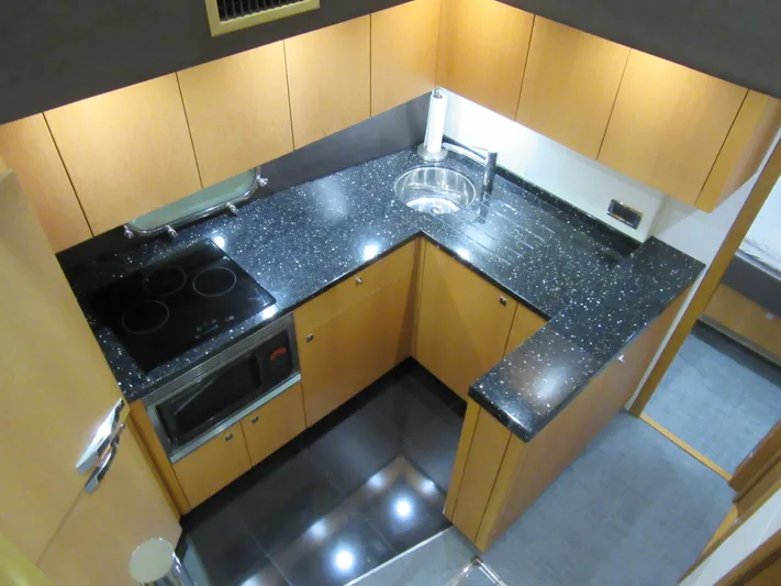 Skeis The Limit Yacht Photos Pics Modern kitchen in 2014 Sunseeker Manhattan 53 yacht with sleek countertops and appliances.