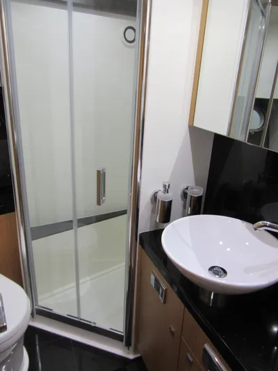 Skeis The Limit Yacht Photos Pics Bathroom interior of 2014 Sunseeker Manhattan 53 yacht with modern shower and sink.