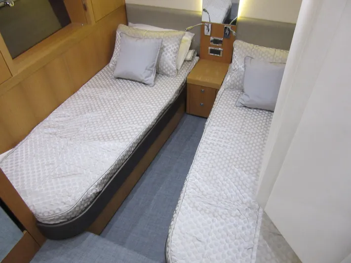 Skeis The Limit Yacht Photos Pics Twin cabin in 2014 Sunseeker Manhattan 53 yacht with modern decor and cozy bedding.