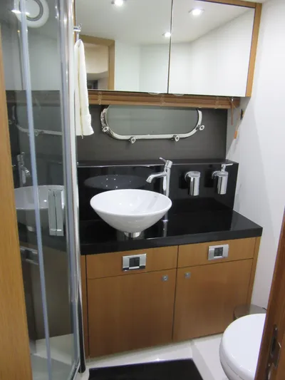 Skeis The Limit Yacht Photos Pics Luxurious bathroom in 2014 Sunseeker Manhattan 53 yacht with modern fixtures and sleek design.