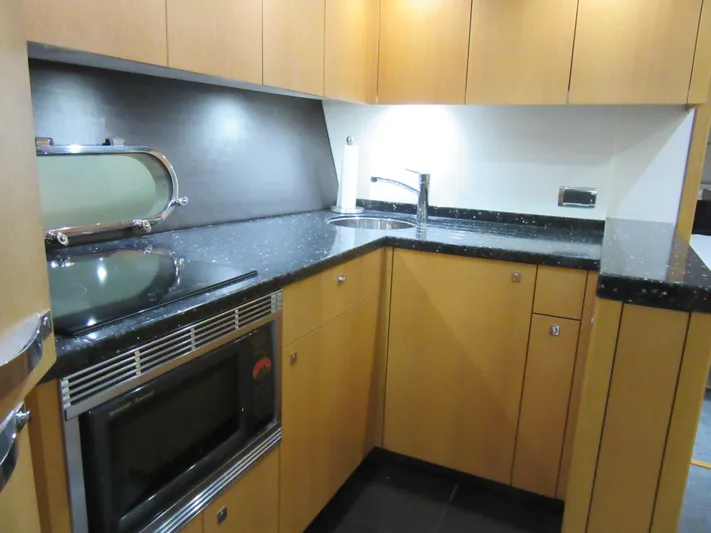 Skeis The Limit Yacht Photos Pics Modern kitchen in 2014 Sunseeker Manhattan 53 yacht with sleek cabinetry and appliances.