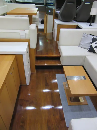 Skeis The Limit Yacht Photos Pics Luxurious interior of 2014 Sunseeker Manhattan 53 yacht with polished wood flooring.