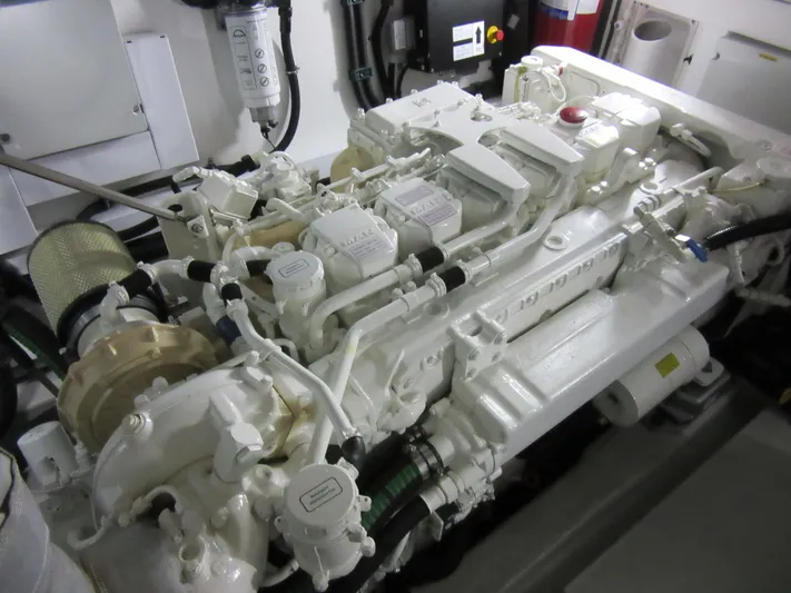 Skeis The Limit Yacht Photos Pics Engine room of 2014 Sunseeker Manhattan 53 yacht, showcasing detailed machinery components.