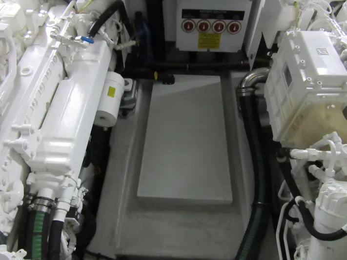 Skeis The Limit Yacht Photos Pics Engine room of a 2014 Sunseeker Manhattan 53 yacht, showcasing mechanical components.