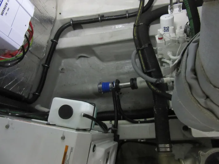 Skeis The Limit Yacht Photos Pics Engine room of 2014 Sunseeker Manhattan 53 yacht, showcasing mechanical components and wiring.