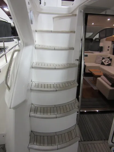 Skeis The Limit Yacht Photos Pics Staircase on 2014 Sunseeker Manhattan 53 yacht leading to interior lounge area.