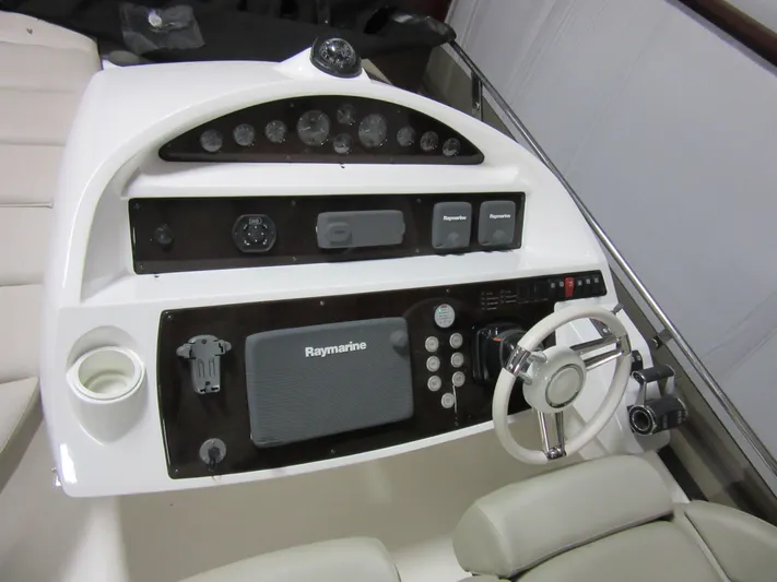 Skeis The Limit Yacht Photos Pics Helm of 2014 Sunseeker Manhattan 53 yacht with Raymarine navigation system.