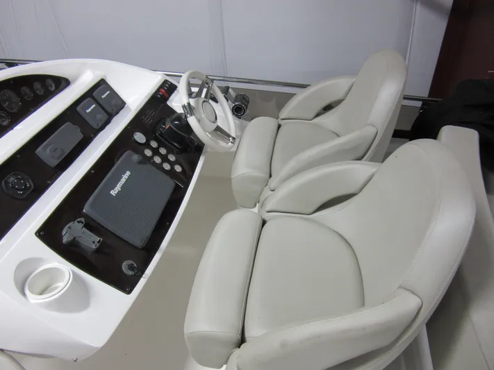 Skeis The Limit Yacht Photos Pics Helm of 2014 Sunseeker Manhattan 53 yacht with dual seats and control panel.