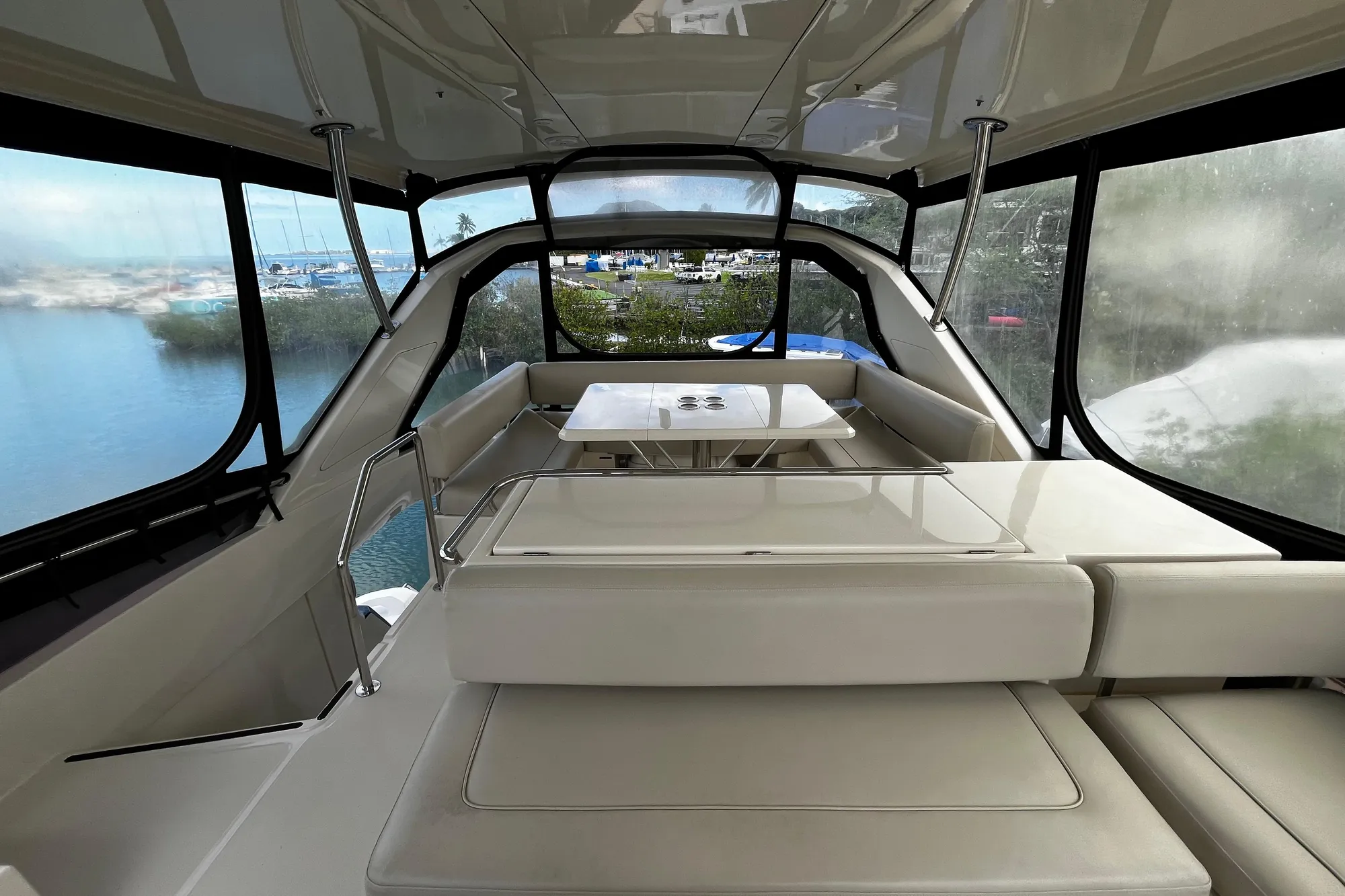 Interior view of 2016 Aquila 44 yacht with spacious seating and panoramic windows.