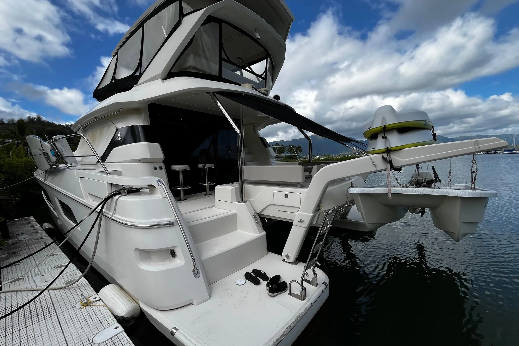 Aquila 44 yacht, 2016 model, docked with clear skies and calm waters.