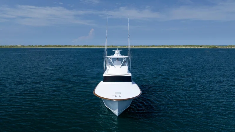 Double B Yacht Photos Pics Custom Carolina Taylor Made 2000 boat on open water under clear sky.