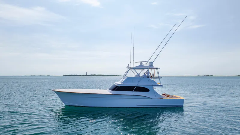 Double B Yacht Photos Pics Custom Carolina Taylor Made 2000 yacht on calm blue waters under clear sky.