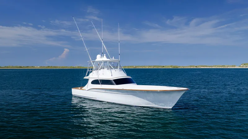 Double B Yacht Photos Pics Custom Carolina Taylor Made 2000 yacht on calm blue waters under clear sky.