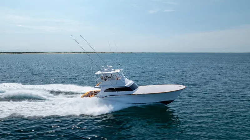 Double B Yacht Photos Pics Custom Carolina Taylor Made 2000 yacht cruising on open sea under clear sky.