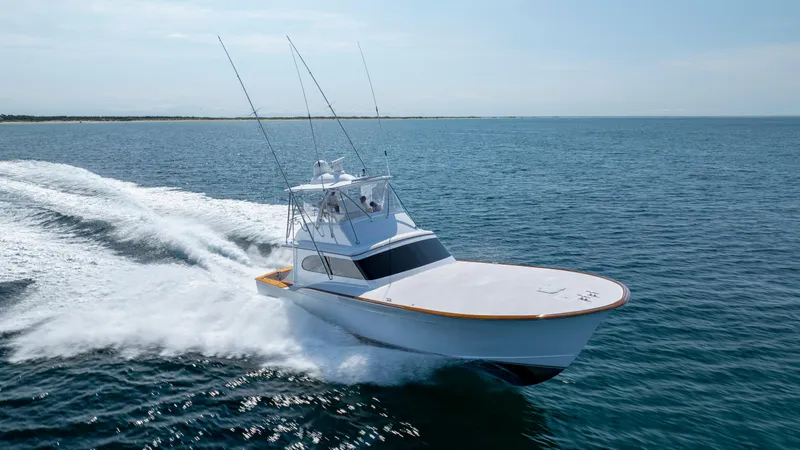 Double B Yacht Photos Pics Custom Carolina Taylor Made 2000 boat cruising on open water.