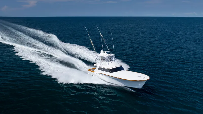 Double B Yacht Photos Pics Custom Carolina Taylor Made 2000 boat cruising on open ocean waters.