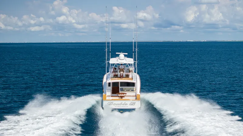 Double B Yacht Photos Pics Custom Carolina Taylor Made 2000 yacht cruising on open ocean under clear skies.