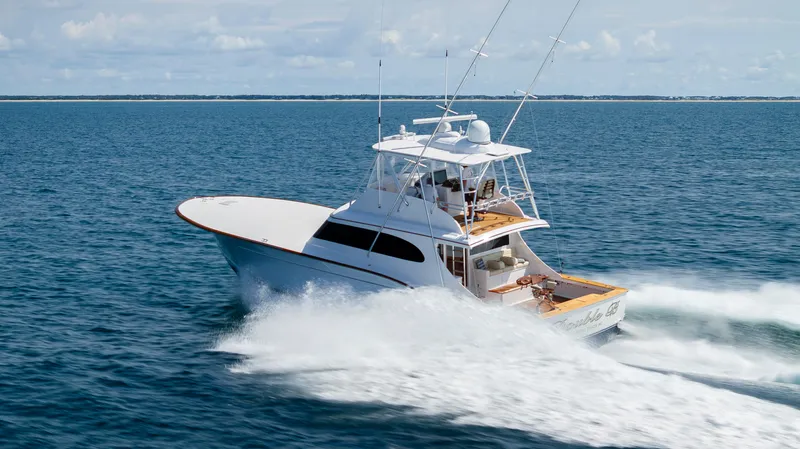 Double B Yacht Photos Pics Custom Carolina Taylor Made 2000 yacht cruising on open sea, creating a dynamic water trail.