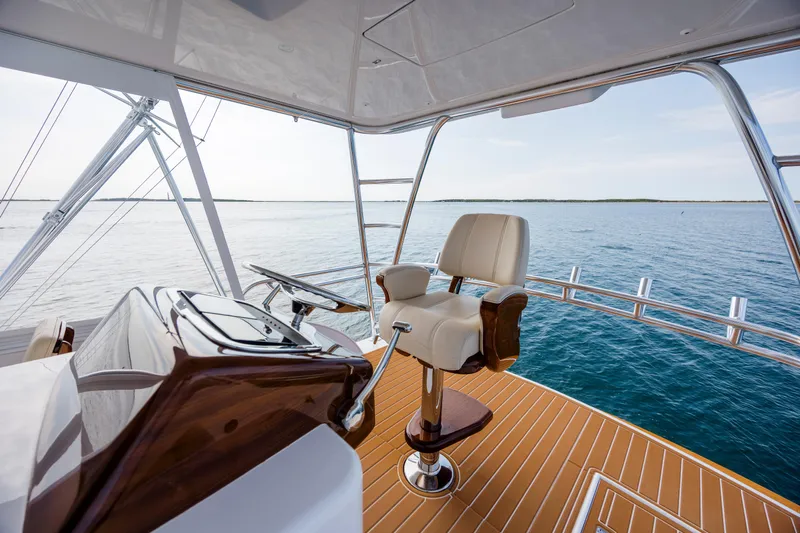 Double B Yacht Photos Pics Captain's chair on Custom Carolina Taylor Made yacht, 2000, overlooking serene ocean waters.