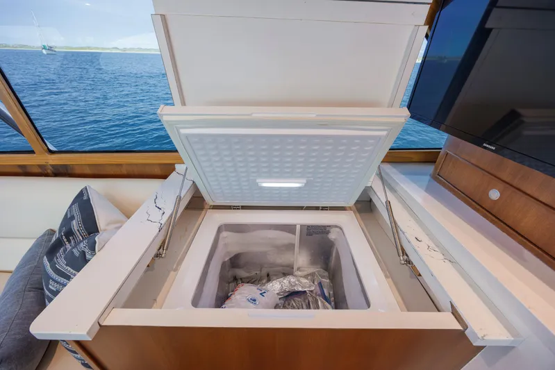 Double B Yacht Photos Pics Open freezer on Custom Carolina Taylor Made yacht, 2000 model, with ocean view through window.
