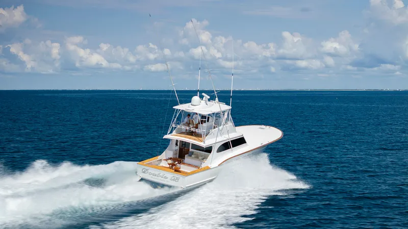 Double B Yacht Photos Pics Custom Carolina Taylor Made 2000 yacht cruising on open ocean under clear skies.