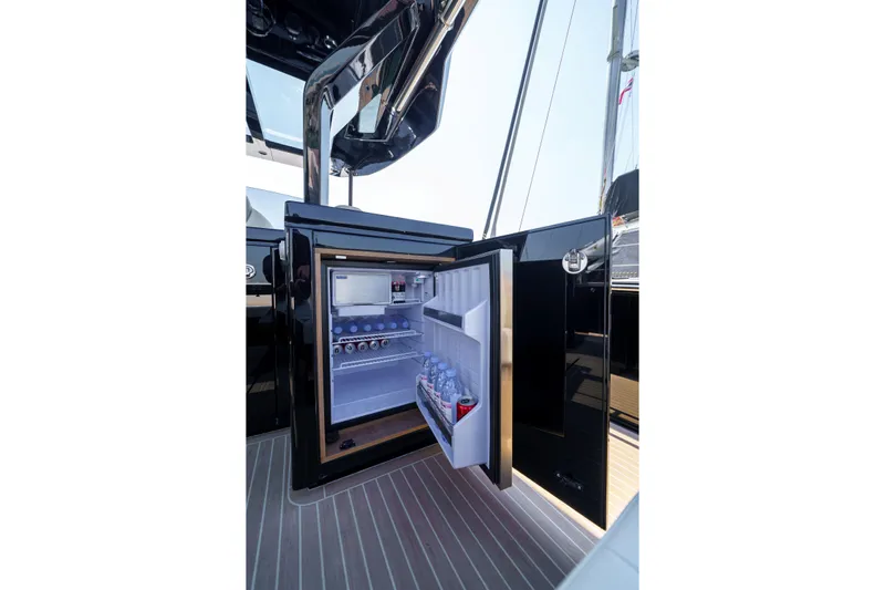  Yacht Photos Pics Open fridge on 2024 Pardo Yachts P50, showcasing interior storage and beverages.