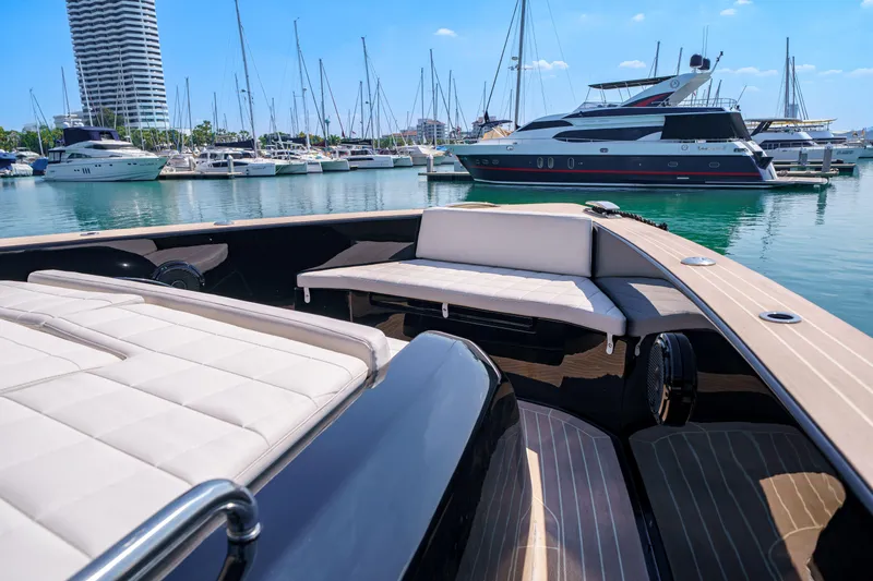  Yacht Photos Pics Luxurious 2024 Pardo Yachts P50 at marina, showcasing elegant deck seating and sleek design.