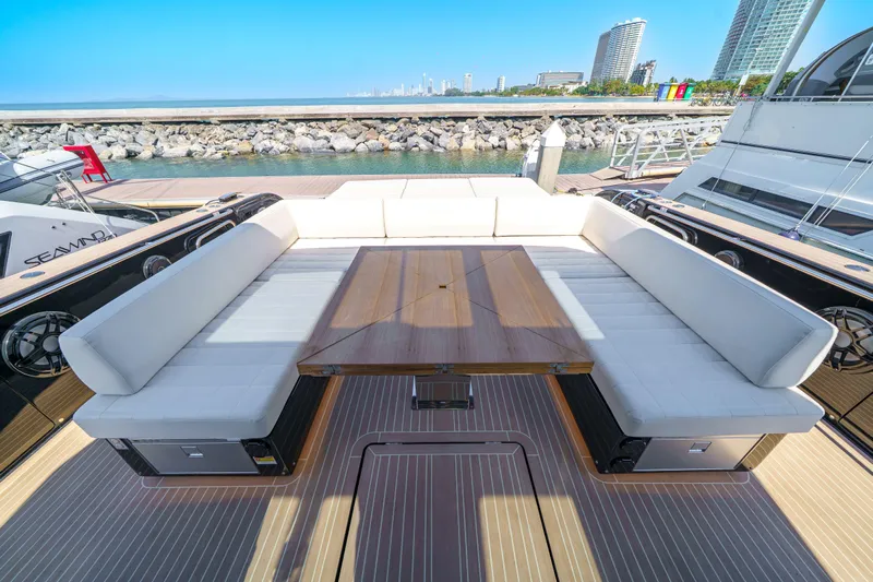  Yacht Photos Pics Luxurious 2024 Pardo Yachts P50 deck with elegant seating and wooden table.