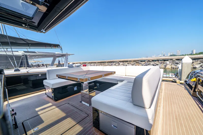  Yacht Photos Pics 2024 Pardo Yachts P50 luxury deck with seating and table, docked by the waterfront.