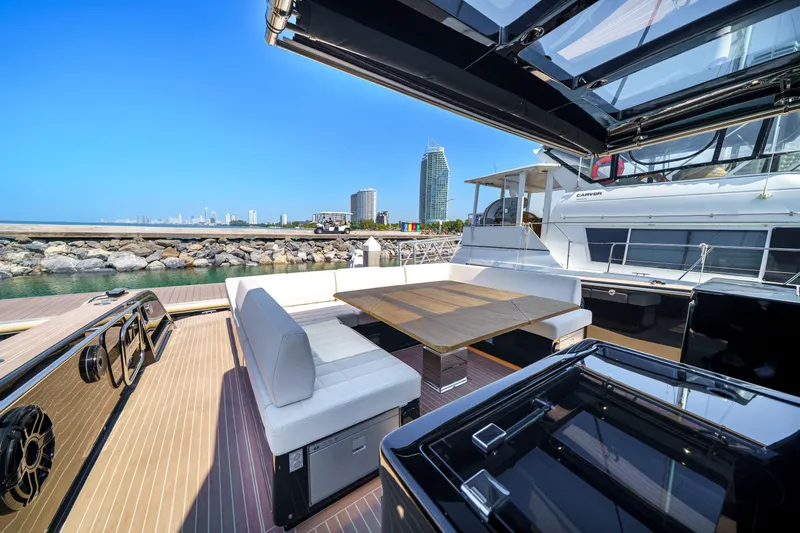  Yacht Photos Pics 2024 Pardo Yachts P50 luxury deck with seating, table, and ocean view.