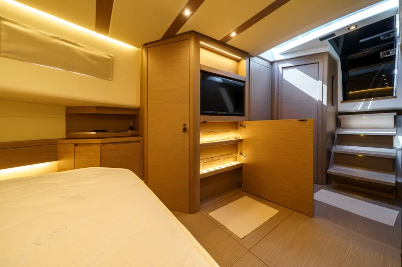  Yacht Photos Pics Luxurious interior of 2024 Pardo Yachts P50, featuring modern wood finishes and ambient lighting.