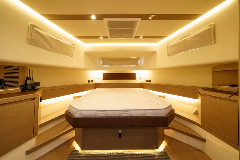  Yacht Photos Pics Luxurious interior cabin of 2024 Pardo Yachts P50 with modern lighting and wood finishes.