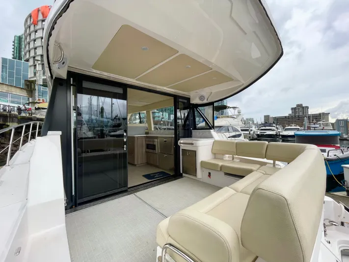 About Time Yacht Photos Pics 2022 Regal 42 Grande Coupe yacht with spacious deck and modern interior at marina.