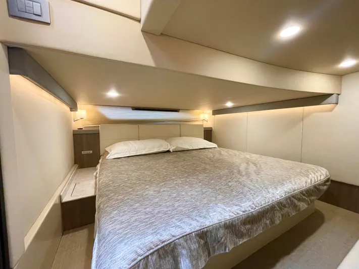 About Time Yacht Photos Pics Luxurious bedroom interior of 2022 Regal 42 Grande Coupe yacht.