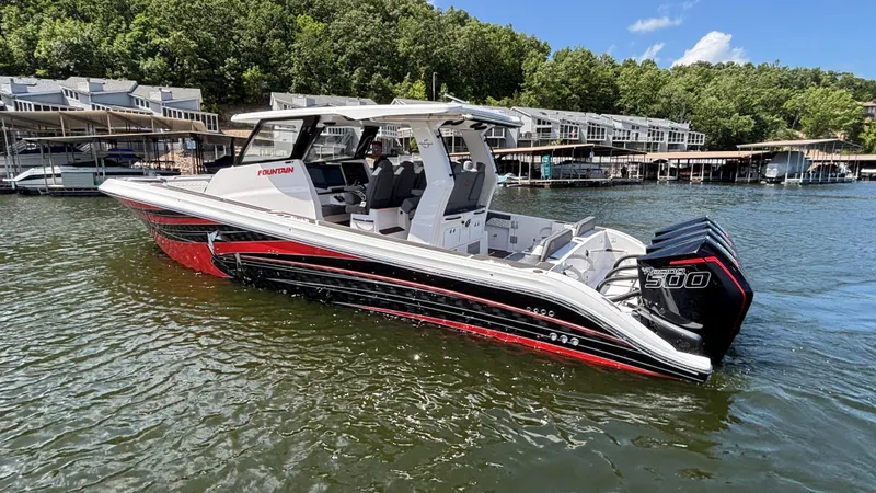 Yacht Photos Pics 2024 Fountain 43 SCX boat on water, featuring sleek design and powerful engines.