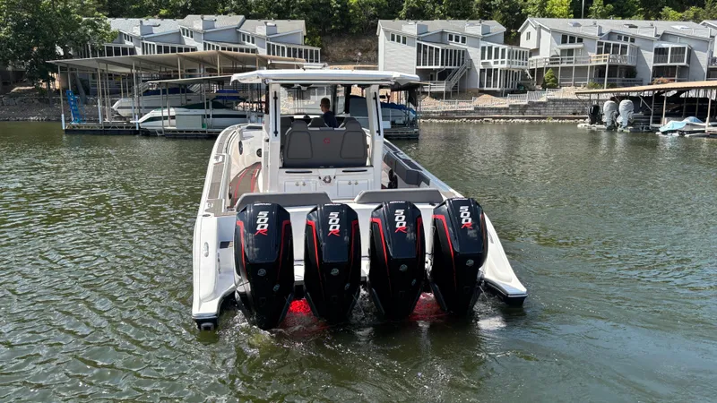  Yacht Photos Pics 2024 Fountain 43 SCX boat with four powerful outboard motors on a lake.