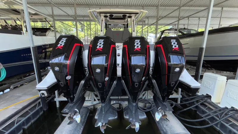  Yacht Photos Pics 2024 Fountain 43 SCX boat with four powerful 500R outboard engines in a marina.