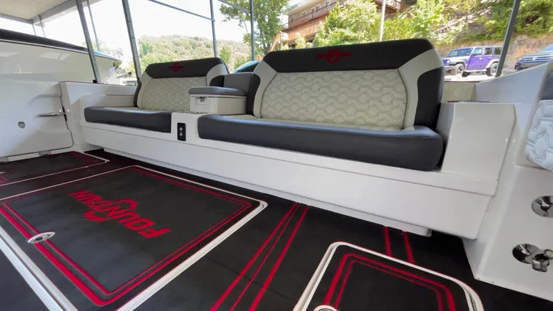  Yacht Photos Pics 2024 Fountain 43 SCX boat interior with stylish seating and branded floor mats.