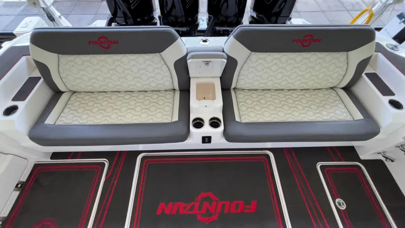  Yacht Photos Pics 2024 Fountain 43 SCX boat interior with stylish seating and branded flooring.