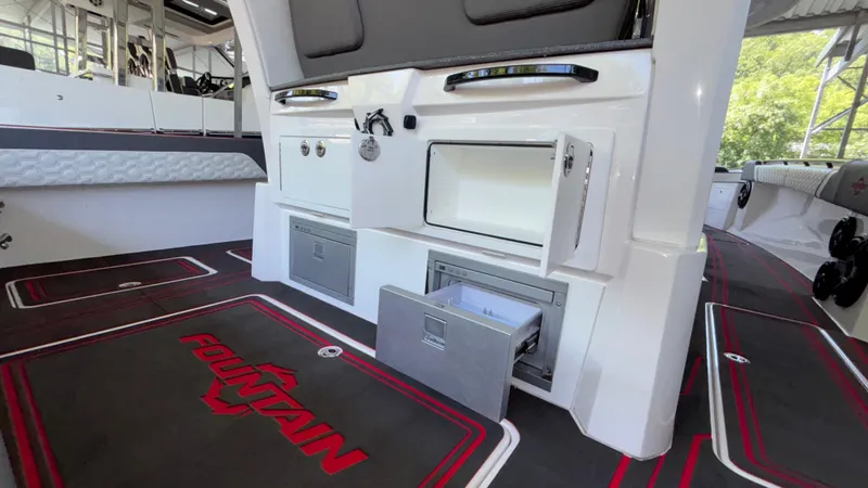  Yacht Photos Pics 2024 Fountain 43 SCX boat interior with storage compartments and branded flooring.