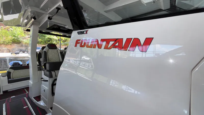  Yacht Photos Pics 2024 Fountain 43 SCX boat interior with logo, showcasing luxury seating and modern design.