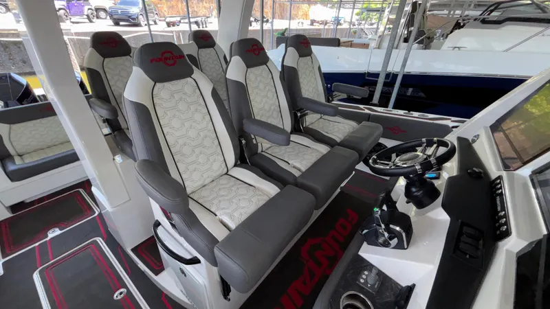  Yacht Photos Pics 2024 Fountain 43 SCX boat interior with luxurious seating and modern dashboard.