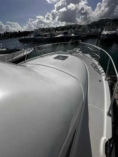  Yacht Photos Pics 2006 Tiara Yachts 3900 Convertible docked at marina under cloudy sky.