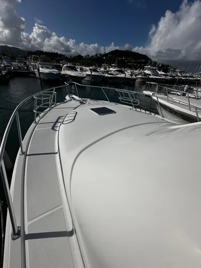  Yacht Photos Pics 2006 Tiara Yachts 3900 Convertible docked in a marina under a cloudy sky.